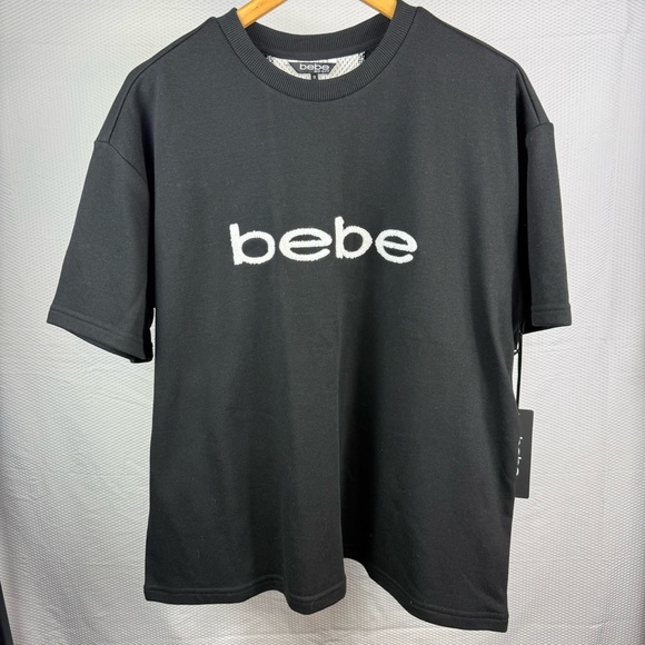 NEW Bebe Plus sport black short sleeve with sport patch woman’s shirt Size 1X - Picture 1 of 6